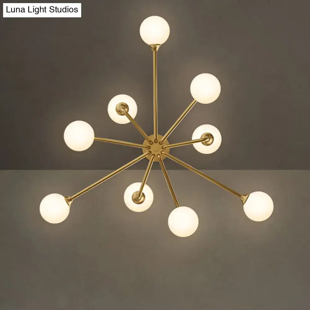 Gold-toned sputnik pendant lighting with eight white glass shades in a starburst design for elegant living room décor