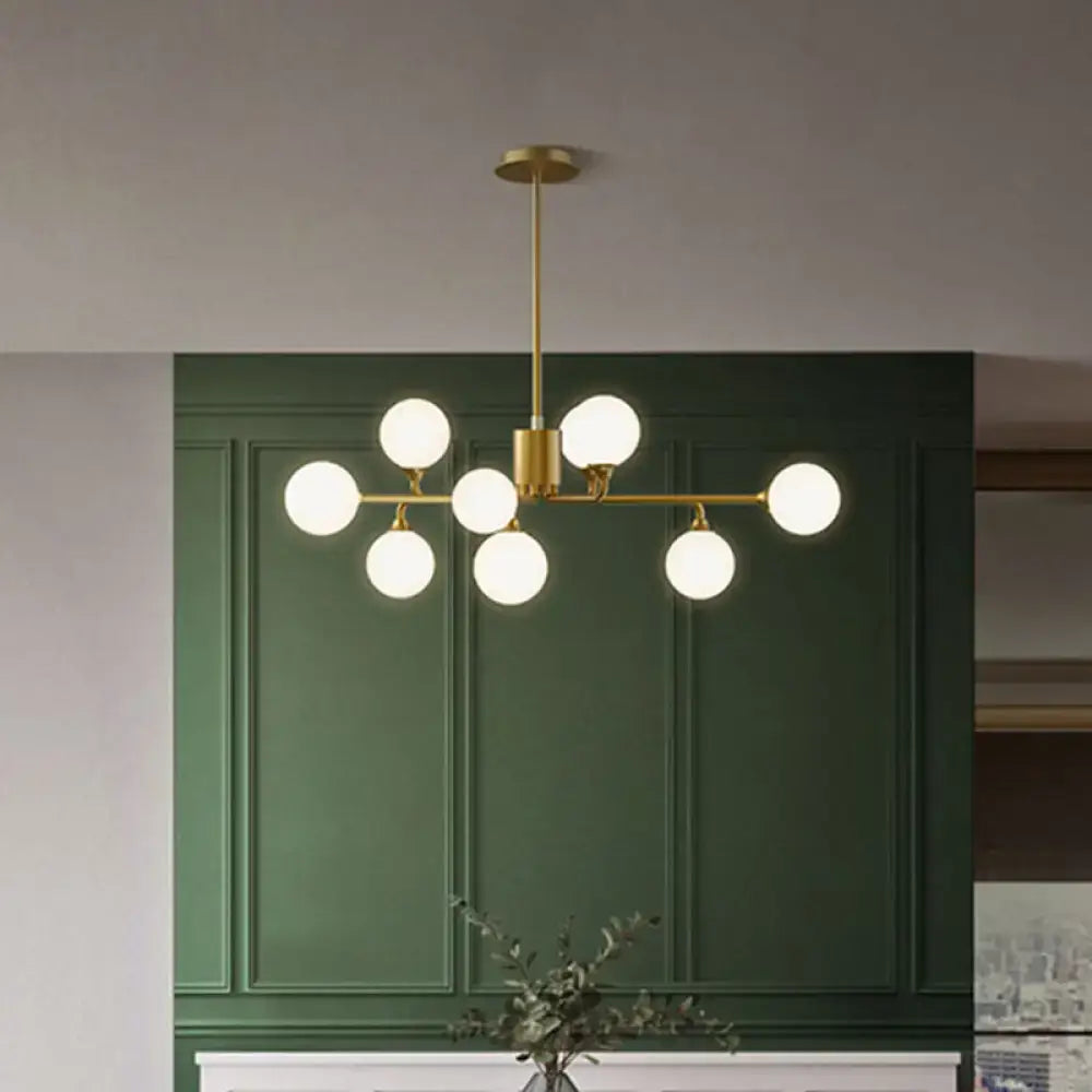 Gold-toned decorbites sputnik pendant lighting with seven white glass shades for modern living room decor