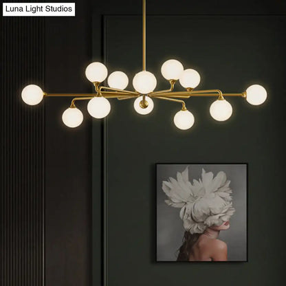 Gold-toned DecorBites™ sputnik pendant lighting with white glass shades modernizes your living room