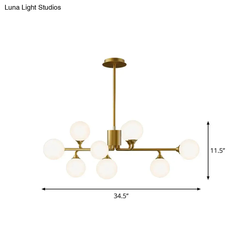Gold-toned DecorBites™ sputnik pendant lighting with eight white glass shades modernizes living room decor