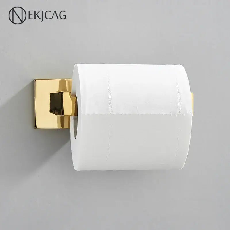 Gold-finished modern gold square paper holder wall mount holding a standard white toilet paper roll for bathroom use