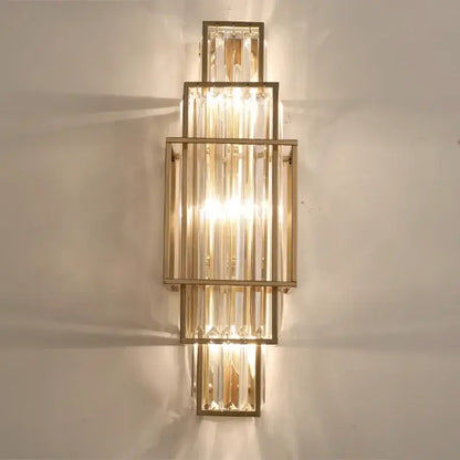 Modern gold wall lamp with stacked glass crystal rods and tiered design for luxury bedroom lighting