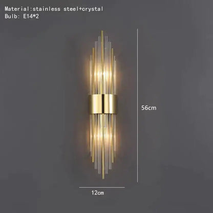 Modern gold wall lamp featuring vertical stainless steel and clear crystal rods for elegant bedroom lighting