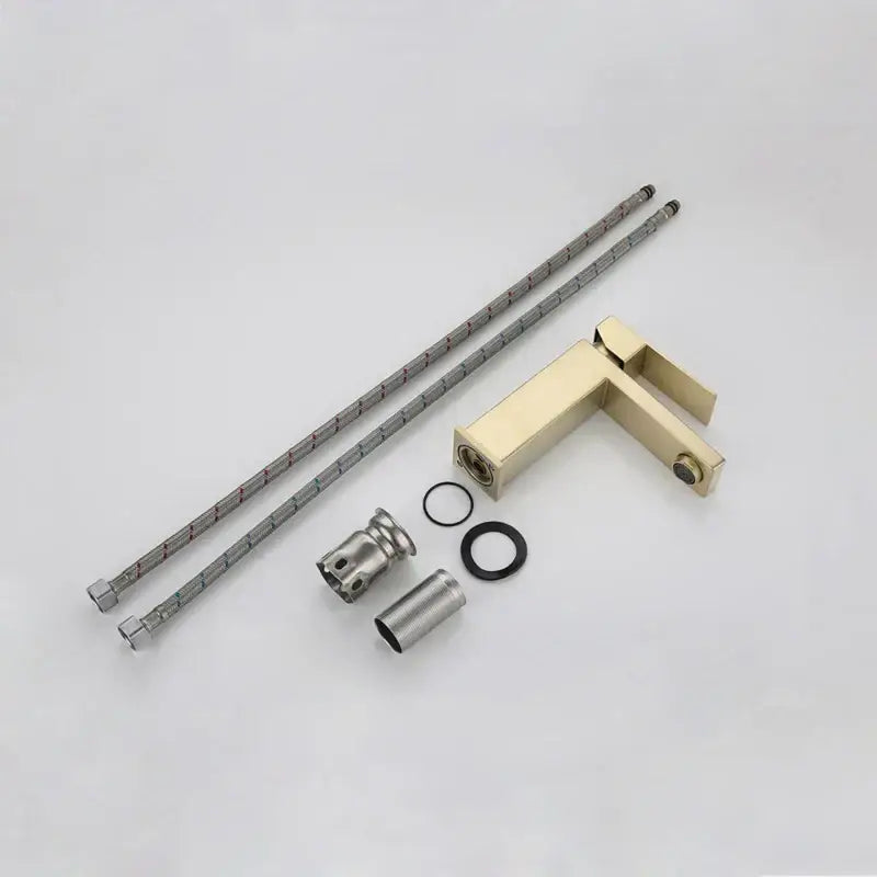 Modern gold stainless steel basin faucet with sleek rectangular design and matching braided metal hoses decorbites gold stainless