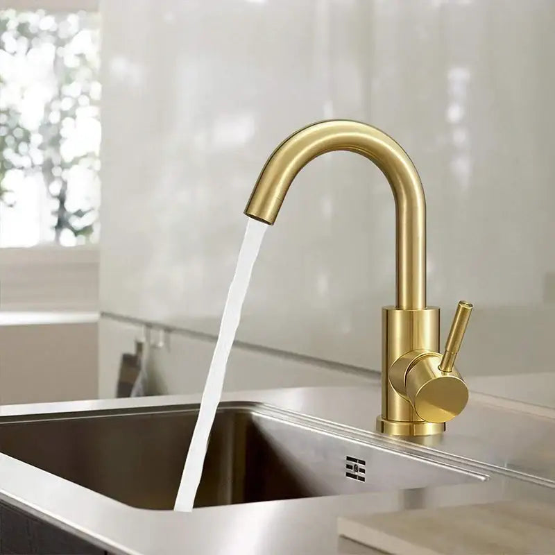 Modern gold stainless steel basin faucet with sleek curved spout and cylindrical handle for bathroom sinks decorbites gold stainless