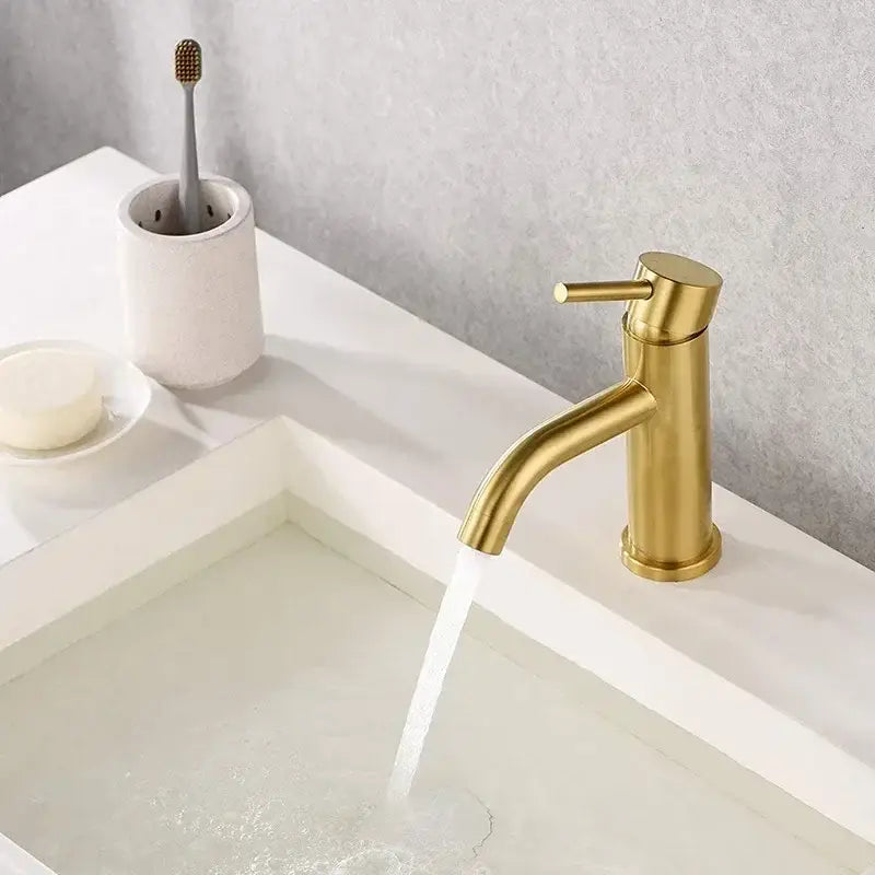Modern gold stainless steel basin faucet with single handle and sleek design for bathroom sink by decorbites gold stainless