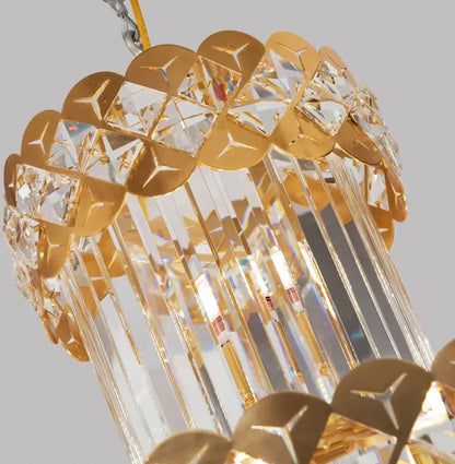 Modern gold stainless steel crystal chandelier with clear prisms and decorative metallic plates for staircase lighting