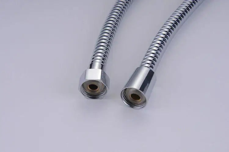 Two chrome finished stainless steel shower hoses with flexible ribbed texture and threaded connectors for decorbites gold stainless replacement