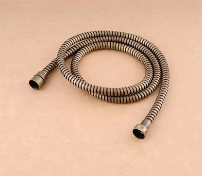 Antique brass-colored decorbites gold stainless steel flexible shower hose with ribbed texture and threaded ends for bathroom replacement