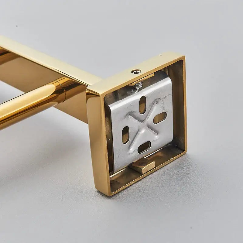 Modern gold stainless steel wall mount towel rack with square base and silver stainless steel wall x-shaped mounting plate