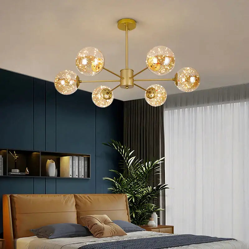 Modern gold star glass pendant light chandelier with six gold-toned spherical glass globes for dining room decorbites gold star