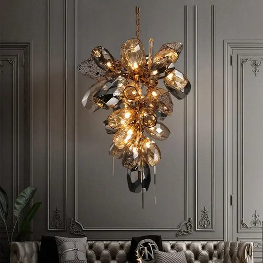 Modern gold steel led pendant lights featuring a gold-toned crystal chandelier with amber and mirrored glass elements