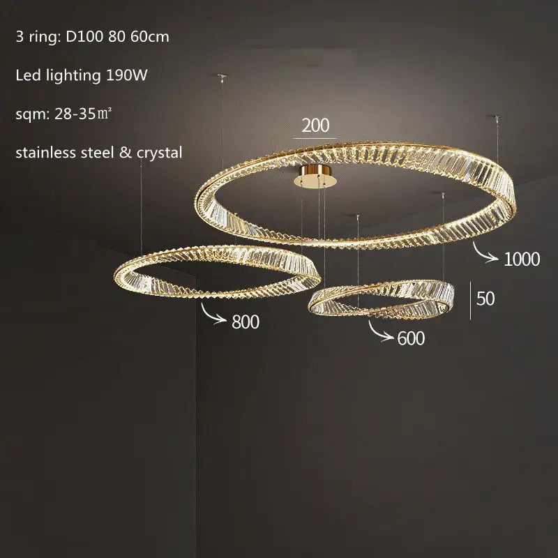Modern three-tiered pendant light with gold steel rings and crystal accents for dining room illumination