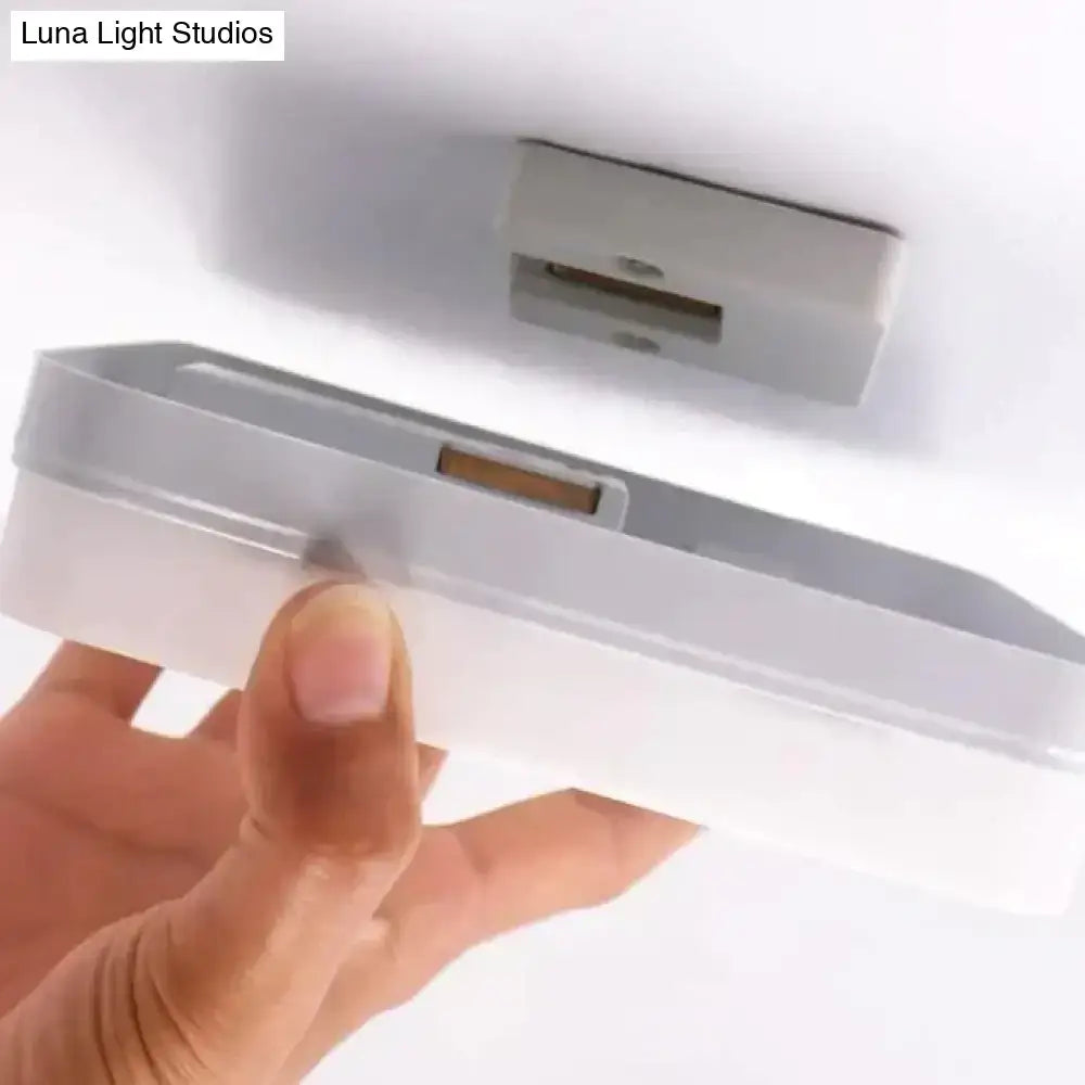 White plastic surface mounted decorbites™ led square panel light with sleek minimalist design available in 18w 24w 36w 48w