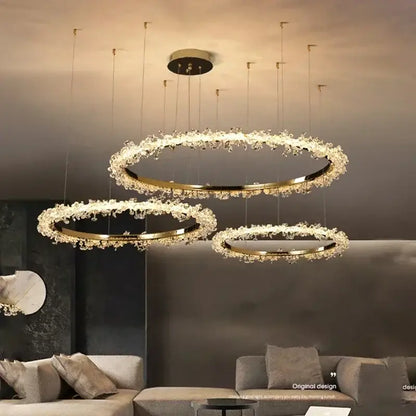 Modern gold swirling crystal pendant chandelier with concentric rings and sparkling accents for elegant dining decorbites crystal pendant