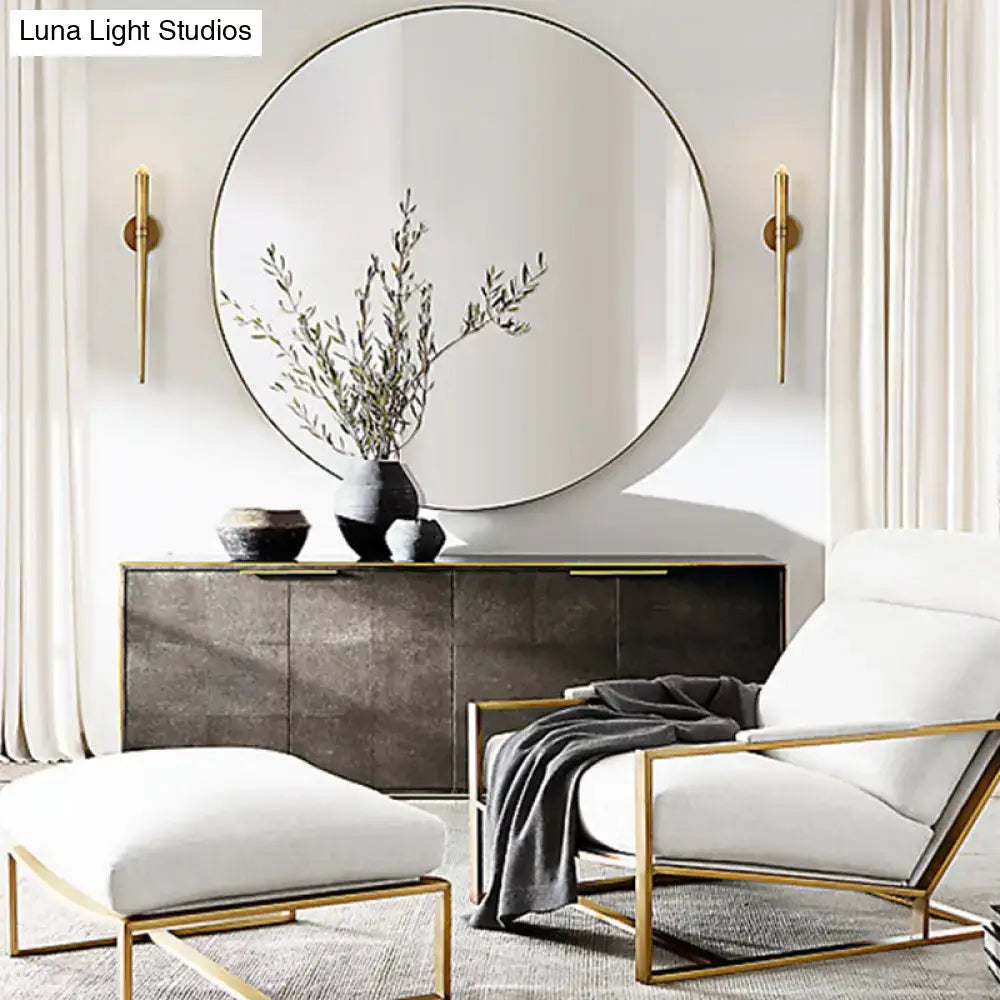 Modern gold tapered crystal led wall lamp with gold-framed circular mirror for sleek living room lighting design