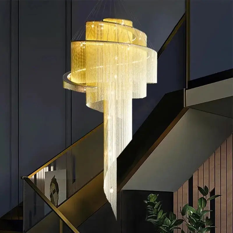 Modern gold tassel led chandelier with cascading crystal strands for elegant living room decorbites gold tassel design