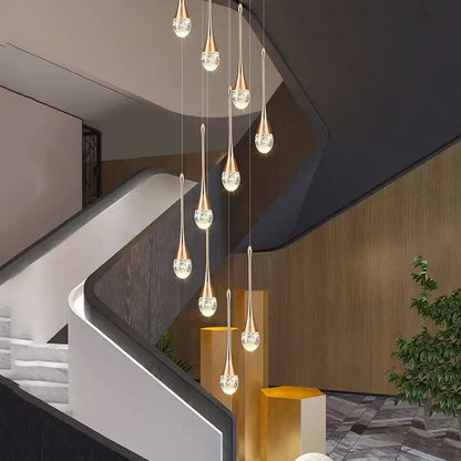 Modern gold teardrop crystal pendant light with elegant crystal accents for dining room pendant lighting