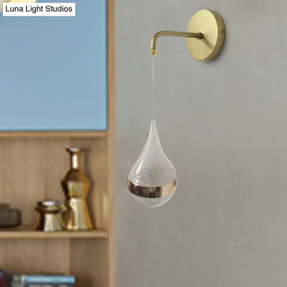 Modern gold teardrop wall sconce with frosted glass and metallic band direct wired electric light for bedroom use