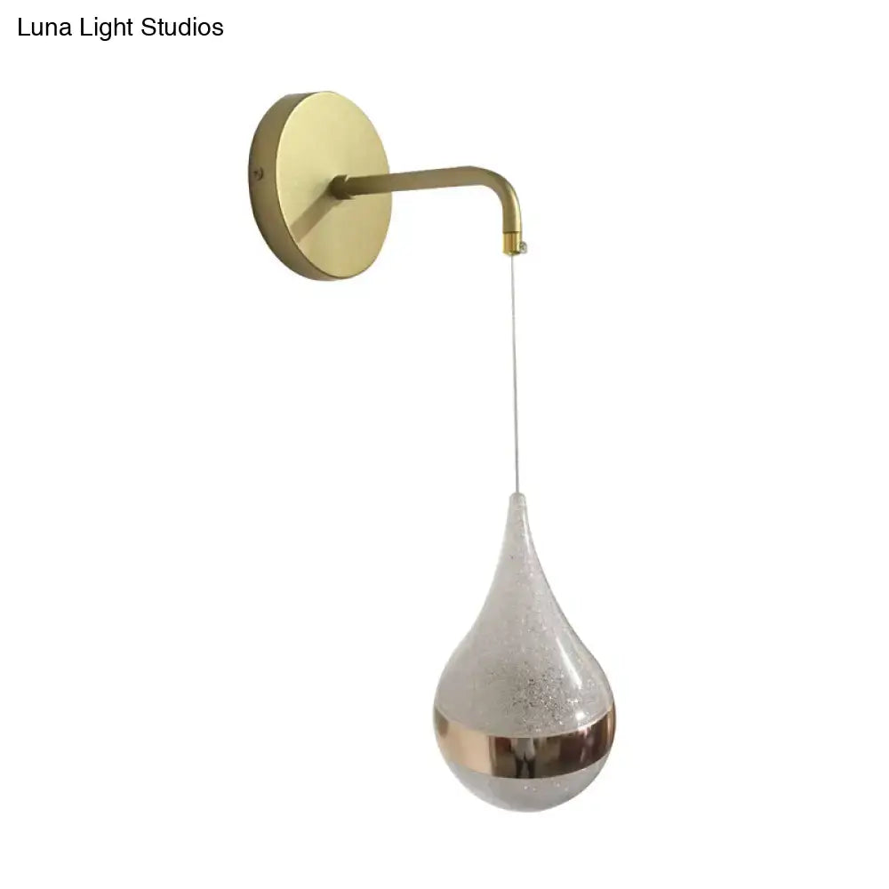 Modern gold teardrop wall sconce with frosted glass and brass mount direct wired electric bedroom light