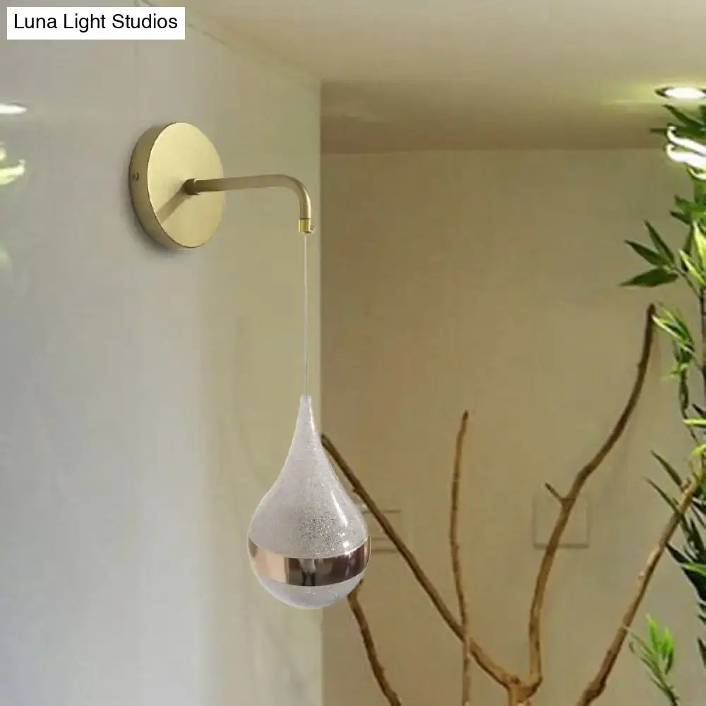 Modern gold teardrop wall sconce with frosted glass and metallic band direct wired electric light for bedroom use