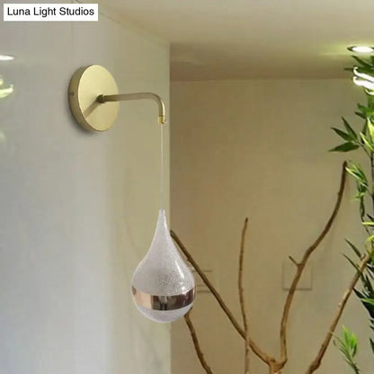 Modern gold teardrop wall sconce with frosted glass and metallic band direct wired electric light for bedroom use