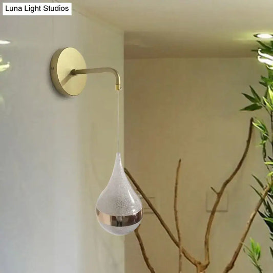 Modern gold teardrop wall sconce with frosted glass and metallic band direct wired electric light for bedroom use