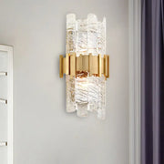 Modern gold textured glass sconce light fixture with clear textured glass and metal frame for bedroom wall lighting