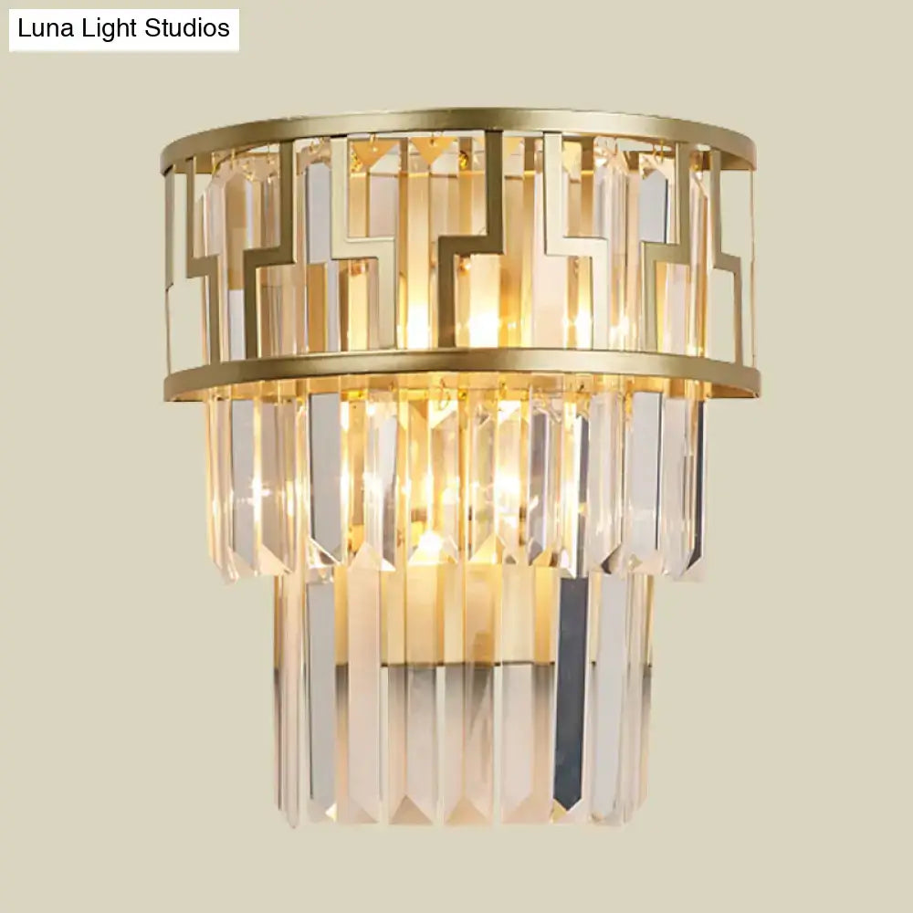 Modern gold tiered bedside wall lamp with crystals featuring cascading clear prism crystals and geometric metal frame