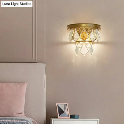 Modern gold tiered sconce light fixture with dangling clear crystals for bedside wall mount in bedroom decor