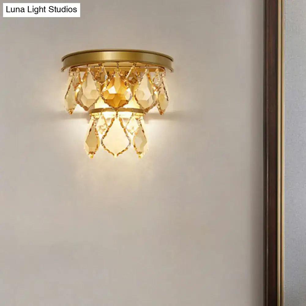 Modern gold tiered sconce light fixture with cascading amber crystals bedside wall mount for bedroom use