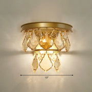 Modern gold tiered sconce light fixture with faceted teardrop crystals bedside wall mount for bedroom use