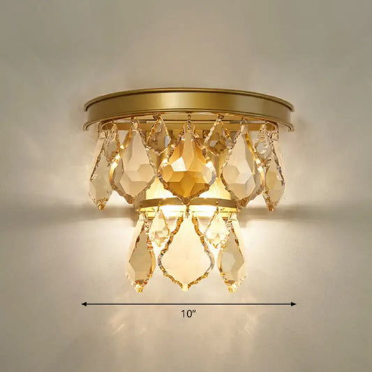 Modern gold tiered sconce light fixture with faceted teardrop crystals bedside wall mount for bedroom use
