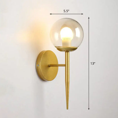 Modern gold torch wall sconce with clear glass globe and slender stem compatible with e26 e27 bulbs for corridor lighting