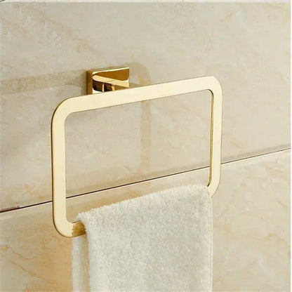 Modern gold towel ranger accessory rack gold-toned rectangular ring with sleek design mounted on tiled wall