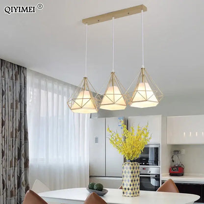 Set of three modern decorbites gold triangle pendant lights with gold metal frames and warm white shades for dining room decor