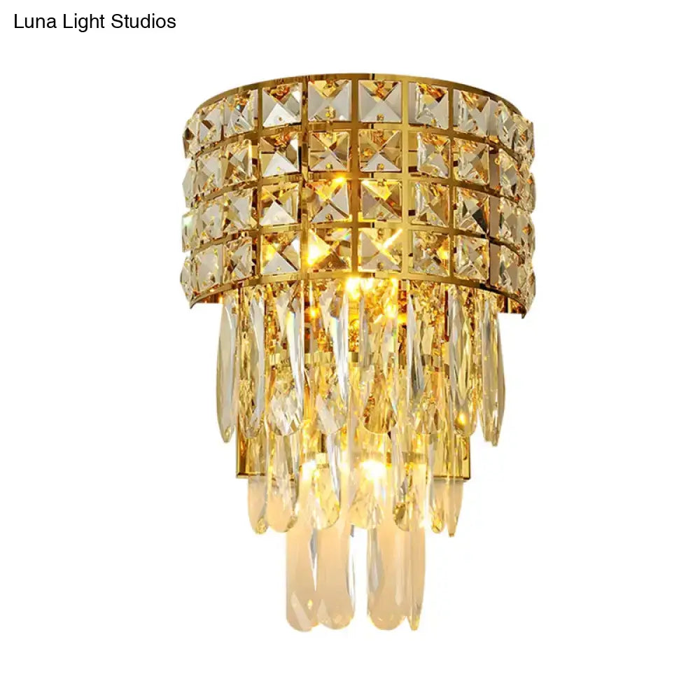 Modern gold triangular crystal wall lamp with tiered gold-toned crystals and teardrop glass for 110v-120v lighting