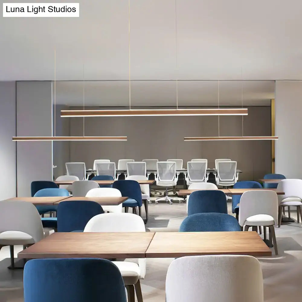 Modern minimalist DecorBites aluminum LED triangular prism pendant lamp with wooden accents for dining room use