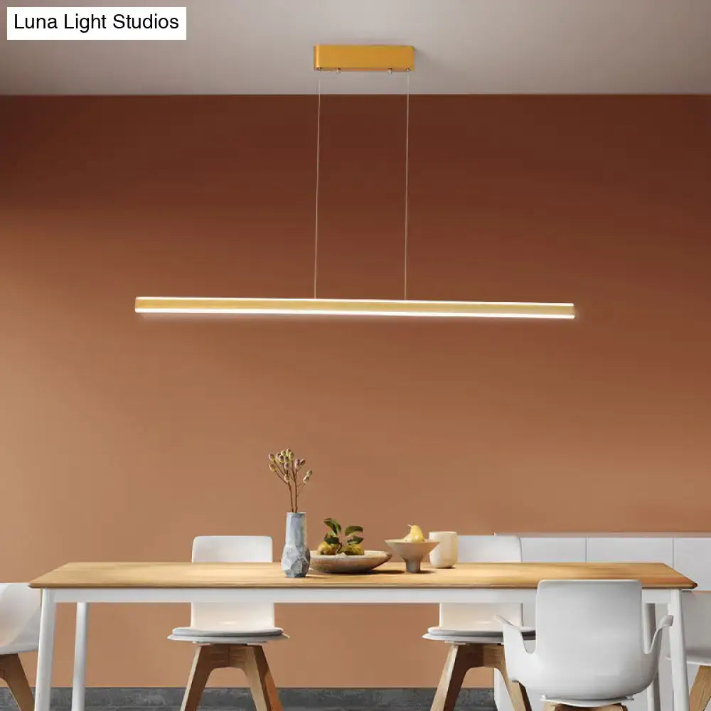 Modern gold-finished aluminum triangular prism pendant lamp for dining room with sleek minimalist design above table