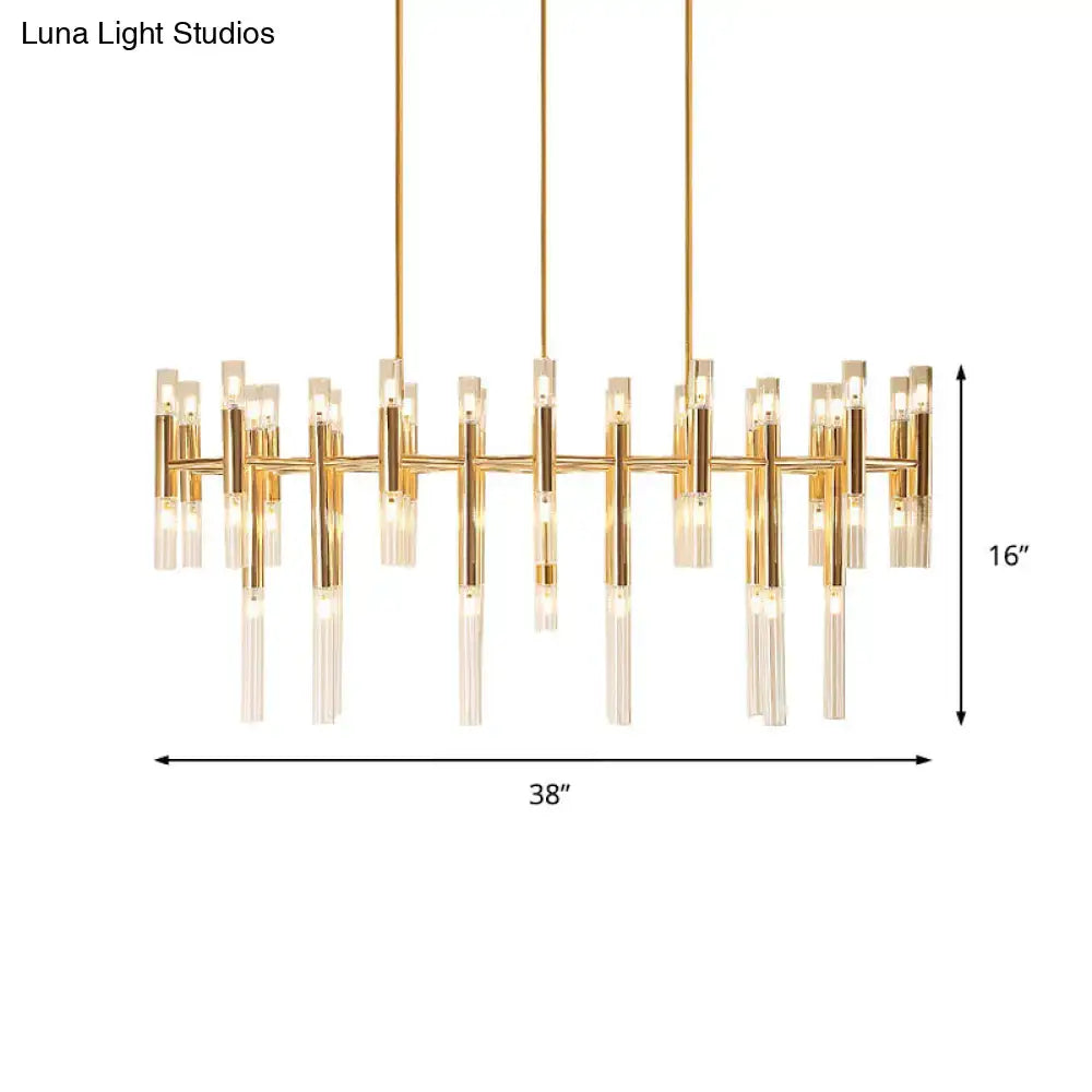 Gold-toned DecorBites tubular led island pendant with clear glass candle elements and geometric linear design for dining room