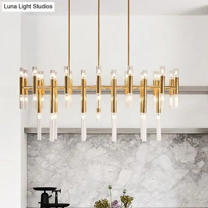 Gold-toned modern DecorBites™ tubular led island pendant with clear acrylic and brass elements for dining room lighting