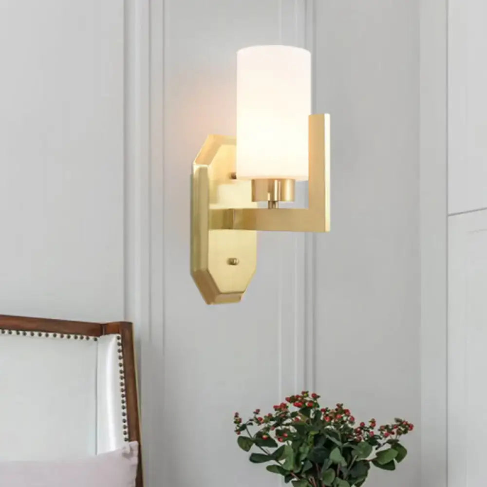 Modern gold tubular wall lamp with a cylindrical frosted glass shade for living room product fixture
