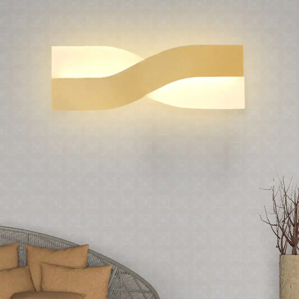 Modern gold-toned wall lamp with sleek twisted design soft ambient lighting fixture width 8in 110v-240v bedroom fixture
