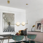 Modern gold two head pendant light with frosted glass shade and bulb base ideal for dining room lighting
