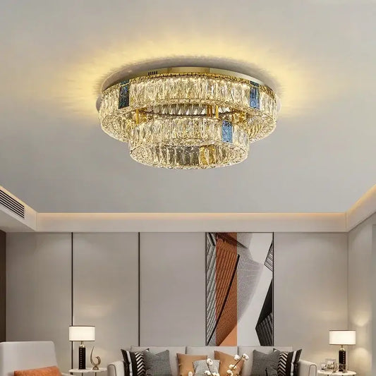 A modern gold two tier crystal led ceiling lamp with faceted clear crystals for living room lighting