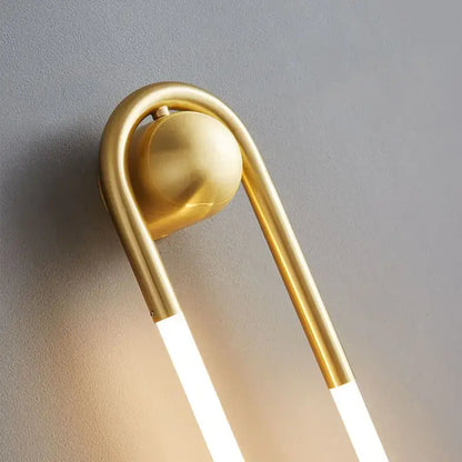 Modern gold u-shaped led wall lights with sleek curved metallic frame and glowing strips for bedroom decorbites ellipse wall lights