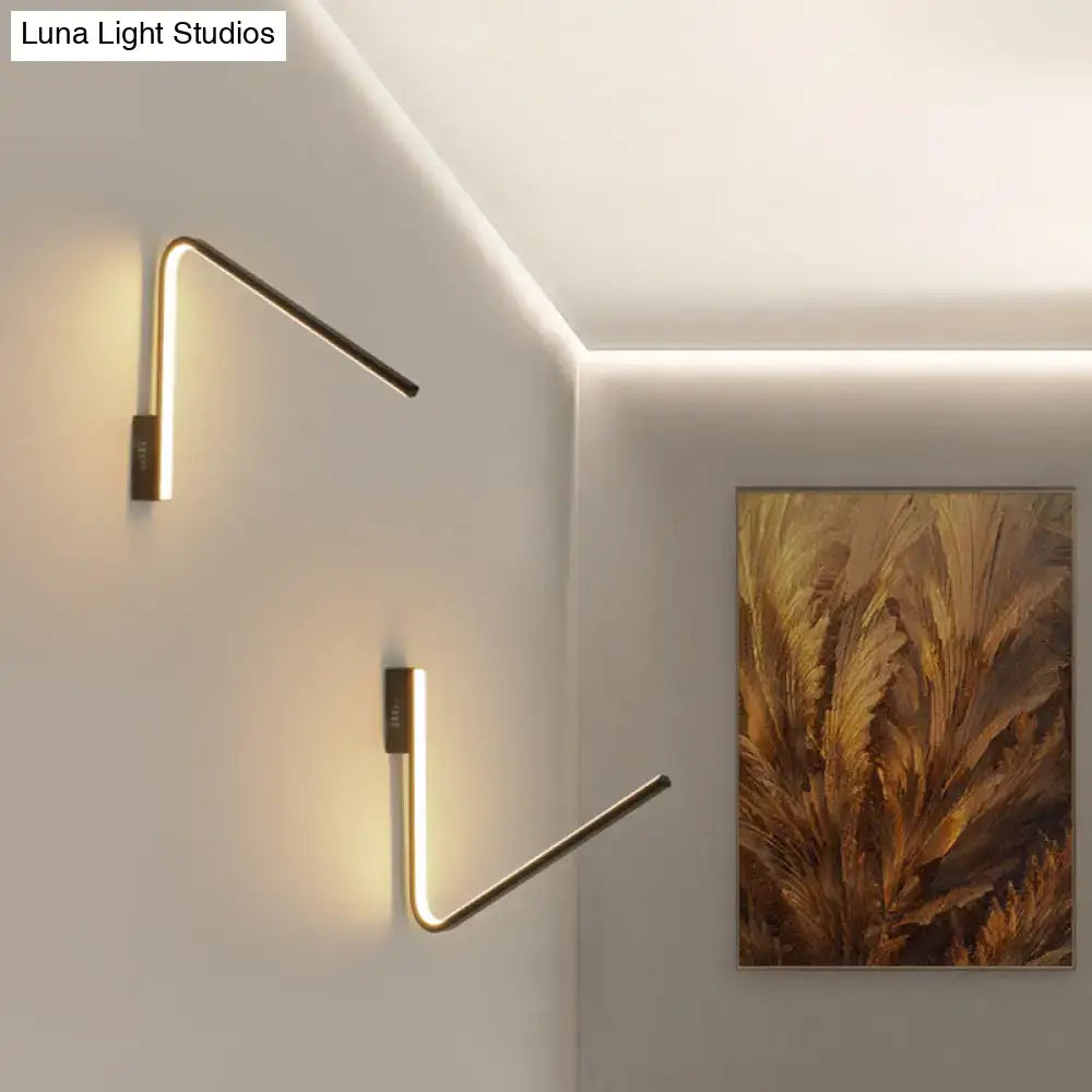 Modern gold v-shaped led sconce with silica gel material emitting warm white light for corridor lighting