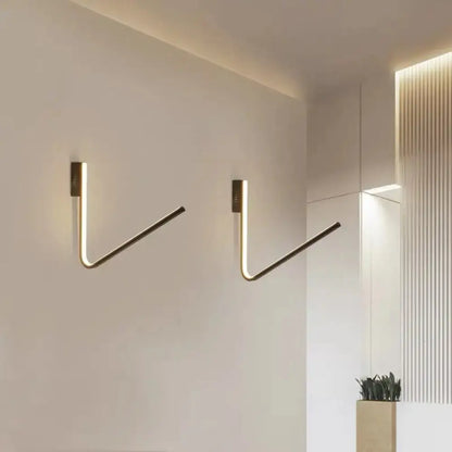 Modern gold v-shaped brass wall-mounted hooks with integrated warm white light and silica gel for corridor use