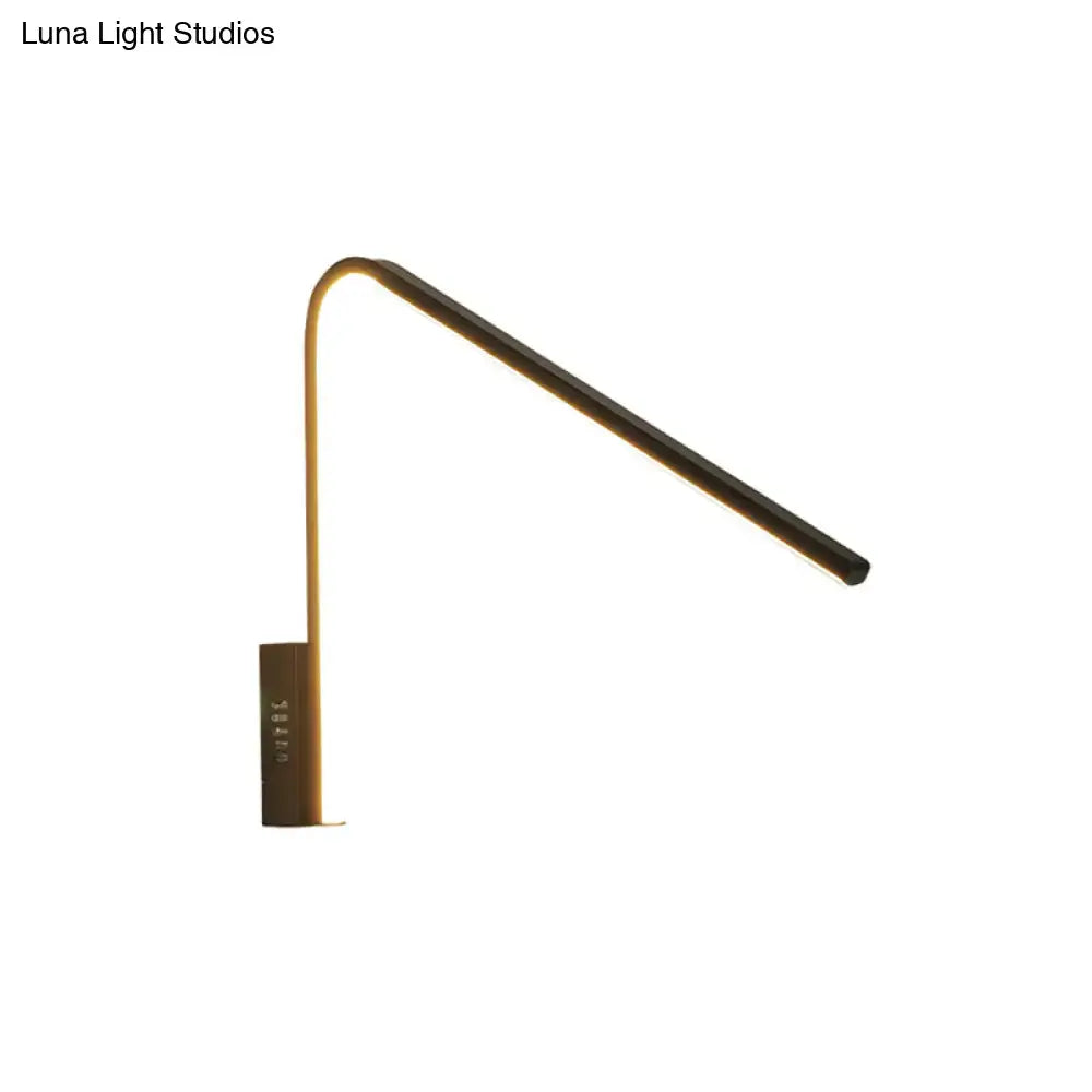 Modern gold v-shaped led sconce with warm white light and silica gel featuring a sleek curved arm design
