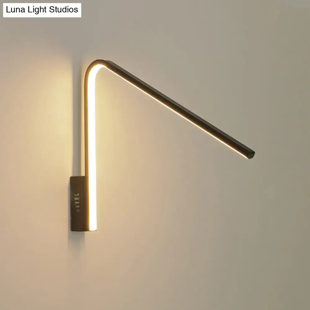 Modern gold v-shaped led sconce with sleek curved silica gel design emitting warm white light for corridors